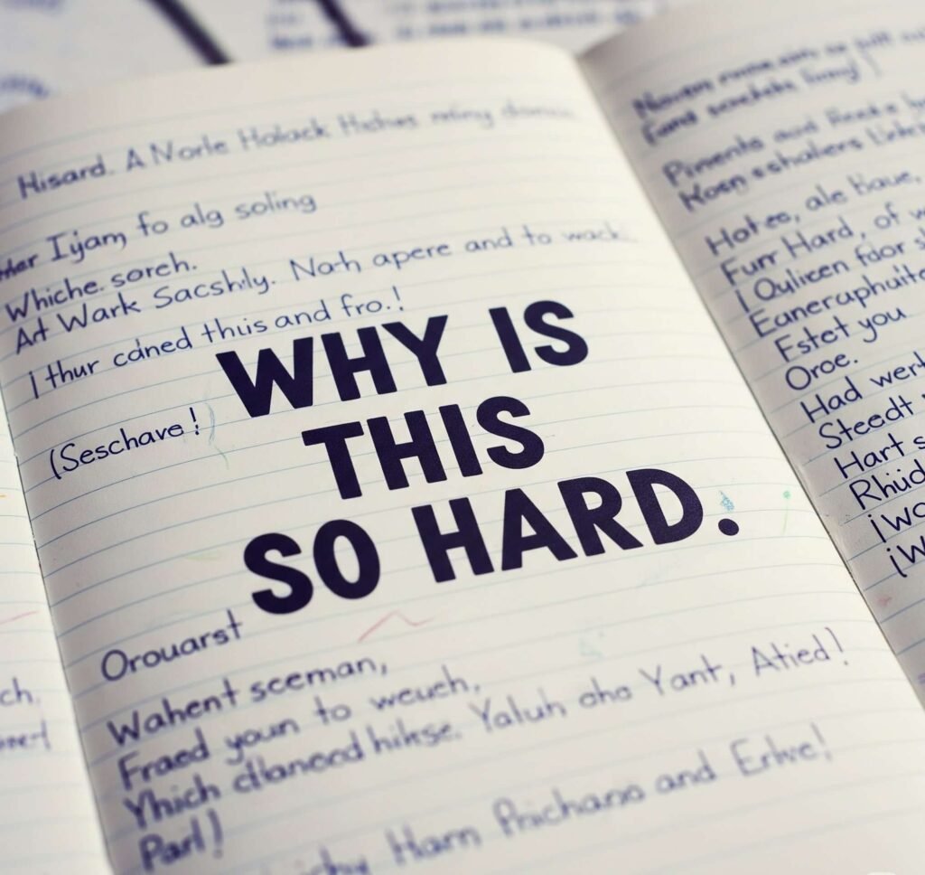 
Frustration Captured: Illegible Notebook with "WHY IS THIS SO HARD