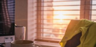 How to Create a Daily Motivation Routine That Works? Cluttered Desk Sunrise: Coffee, Socks, & Hope